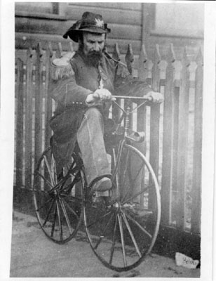 Emperor Norton riding a bike
