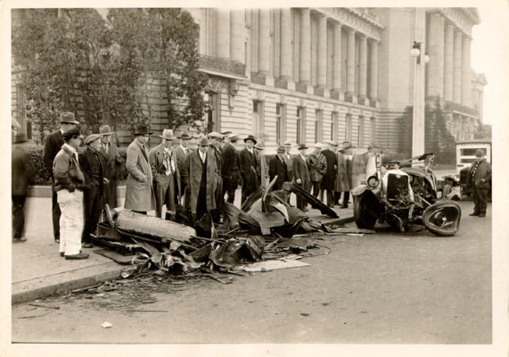 Remains of an automobile that collided with a streetcar in front of City Hall, 1929.